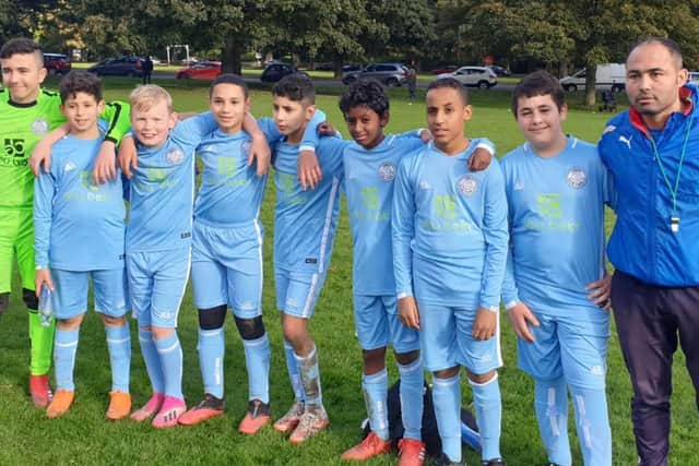 Adel Chermiti with youngsters from Leeds Hyde Park FC