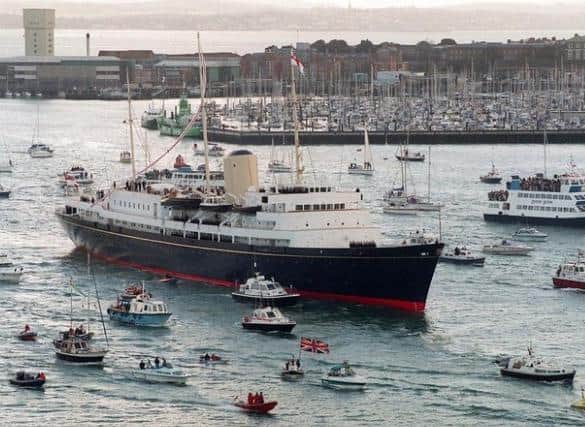 The Royal Yacht Britannia sailing into Portsmouth for the last time before being decommissioned in 1997.