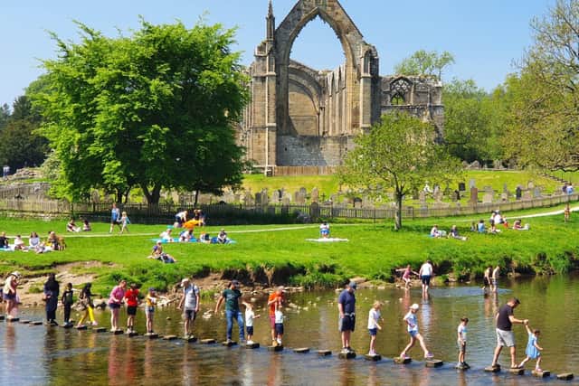 People enjoy the sunshine at Bolton Abbey in Yorkshire, as Bank Holiday Monday could be the hottest day of the year so far - with temperatures predicted to hit 25C in parts of the UK. 
PA WIRE
