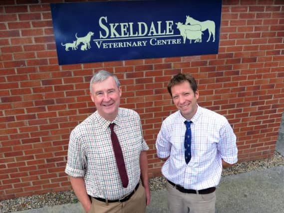 Peter Wright (left) with his former colleague Julian Norton outside Skeldale Veterinary Practice