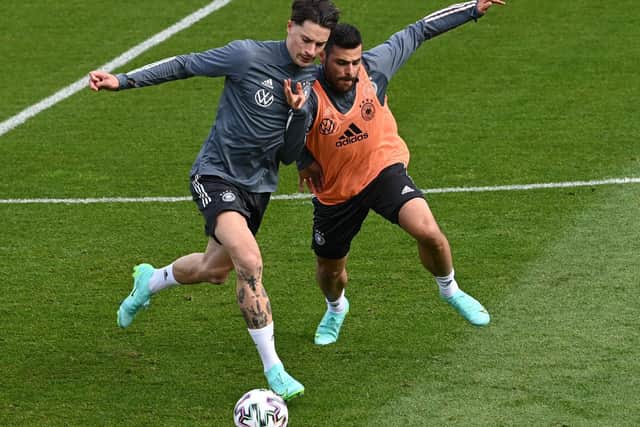 WARMING UP: Leeds United's Robin Koch, left, pictured battling it out with midfielder Kevin Volland in a Germany training session on Saturday, could be in action for his country tonight. Photo by CHRISTOF STACHE/AFP via Getty Images.