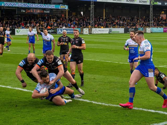 Tom Briscoe scores the first of his two tries in Rhinos' big win at Castleford. Picture by Bruce Rollinson.