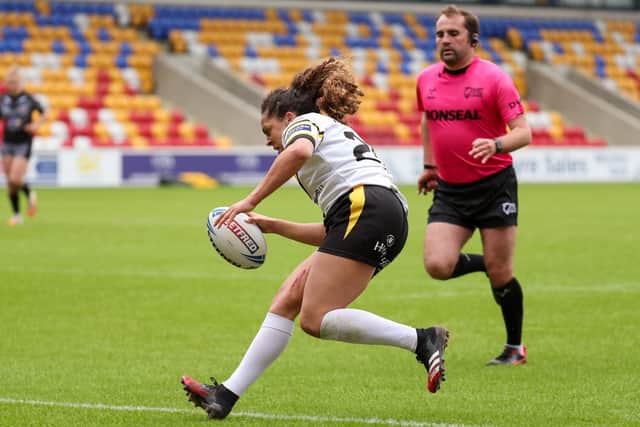 Hat-trick star: York's Savannah Andrade runs in for a try in the semi-final against Castleford.