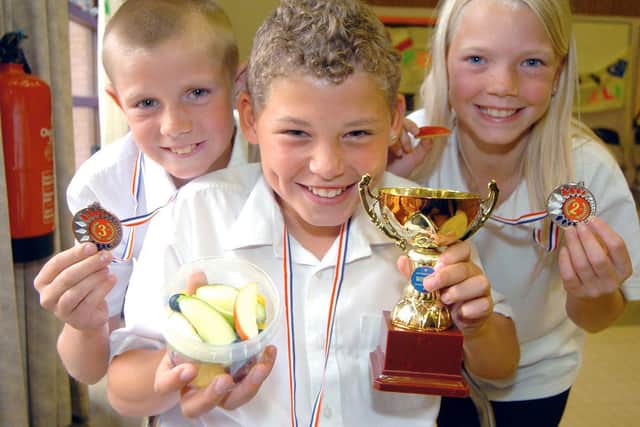 Kalvin pictured alongside Whingate Primary School classmates Peter Hogan and Kirsten Richards in 2007.