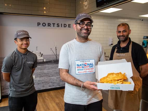 A popular family-run fish and chip shop in Leeds is offering 'free chips for everyone' today to celebrate National Fish and Chip Day and their opening success during lockdown. Pictured is Kully Koda and staff Keldan Copeland and Valjit Sour.
