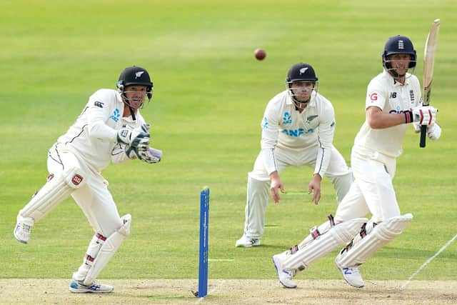 COUNTER ATTACK: England's Joe Root, right, hits a boundary against New Zealand at Lord's today. Picture: Picture: Kirsty Wigglesworth.