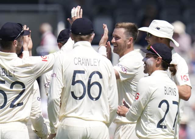 BREAKTHROUGH: England's Ollie Robinson, second from right, celebrates taking the wicket of New Zealand's Colin de Grandhomme. Picture: Kirsty Wigglesworth.