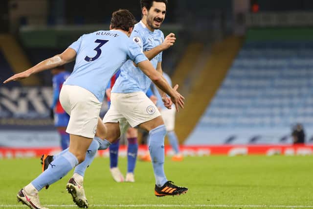 BOTH IN: Manchester City duo Ilkay Gundogan, right, and Ruben Dias, left, as part of six City players in the PFA Premier League team of the year for 2020-21. Photo by Clive Brunskill/Getty Images.