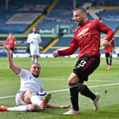 ONE IN, ONE NOT: Leeds United defender Luke Ayling challenges Manchester United's Luke Shaw in April's Premier League clash at Elland Road. Shaw has made the England squad but Ayling hasn't. Photo by PETER POWELL/POOL/AFP via Getty Images.