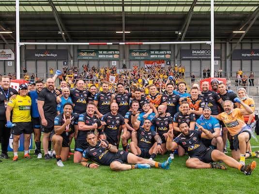 Tigers' squad celebrate with their fans after the semi-final win. Picture by