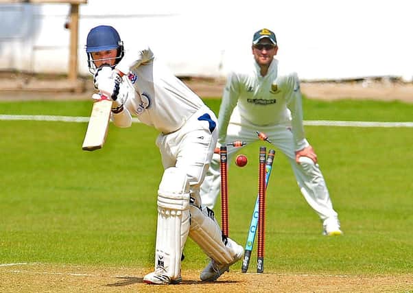Batley's Abdul Wahid is bowled by New Farnley's Sam Lodge for 13. Picture: Steve Riding.