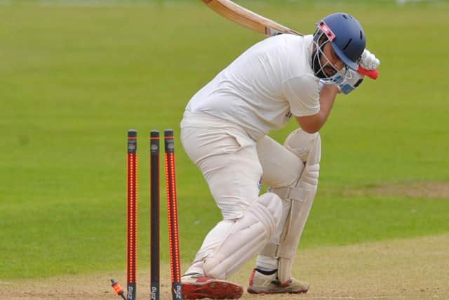 Sufyan Patel of Batley is bowled by New Farnley's Daniel Houghton. Picture: Steve Riding.