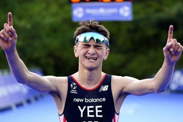 The new No 1- Great Britain's Alex Yee celebrates winning The AJ Bell 2021 World Triathlon Championship Series Mens Race (Picture: Martin Rickett/PA Wire)