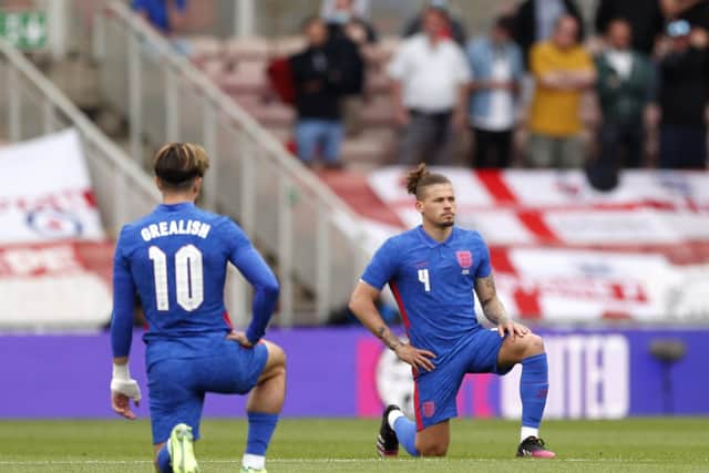 BACK IN THE SIDE: Leeds United's England international midfielder Kalvin Phillips takes a knee before Sunday's friendly against Romania at the Riverside. Picture by Lee Smith/PA Wire.