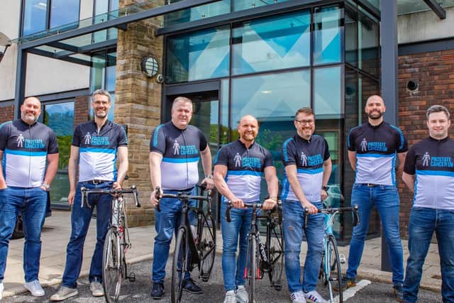 Some of the workmates at Romero Group who are preparing for a coast-to-coast bike ride in memory of former colleague Lloyd Pinder, who lost his battle with prostate cancer last year.