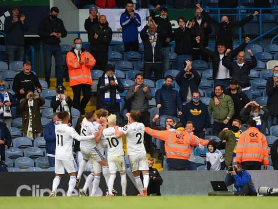 Leeds United's players celebrate with supporters at Elland Road. Pic: Getty