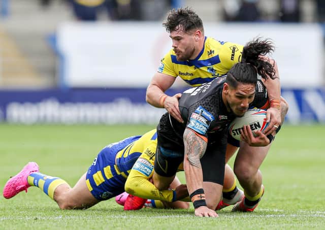 Castleford Tigers' Jesse Sene-Lefao is tackled by Warrington Wolves' Gareth Widdop and Joe Philbin during the Challenge Cup semi-final. Picture: Paul Currie/SWpix.com.
