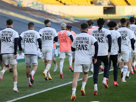 Leeds United display 'earn it' t-shirts in response to the Super League earlier this season. Pic: Getty