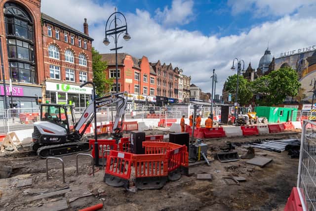 Excavations beneath the road surface near Leeds Corn Exchange have exposed old tram tracks that once ran through the city.