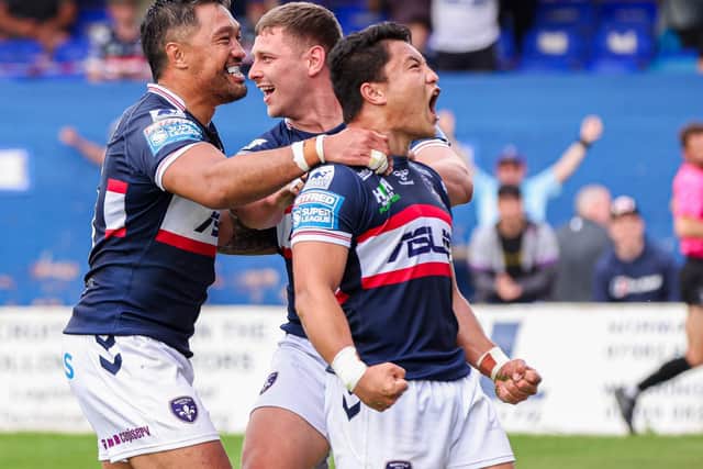 Wakefield's Mason Lino, right, celebrates with Tinirau Arona, left and Brad Walker after his late try clinched an 'ugly' win over Leigh last week. Picture by Alex Whitehead/SWpix.com.
