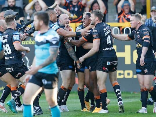 Tigers celebrate Jason Qareqare's debut try. Picture by Ed Sykes/SWpix.com.