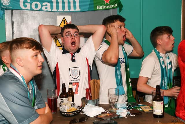 England fans watch the England v Croatia match in the Aire Bar, Leeds.

Picture : Jonathan Gawthorpe