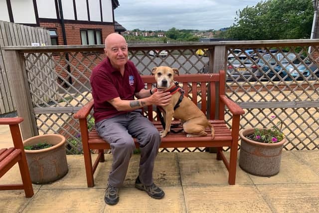 Andy Holmes with Peach the dog