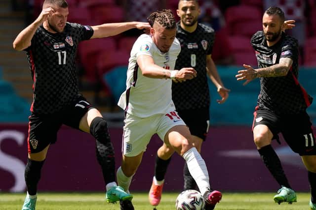 BOSSING IT: Leeds United midfielder Kalvin Phillips takes on all comers as the Whites star excels on his major international tournament debut for England against Croatia. Photo by FRANK AUGSTEIN/POOL/AFP via Getty Images.