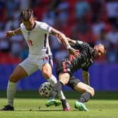 IN THE WAY: Leeds United's England international midfielder Kalvin Phillips, left, battles for possession with Croatia's Marcelo Brozovic during Sunday's Euro 2020 Group D opener at Wembley. Photo by Laurence Griffiths/Getty Images.