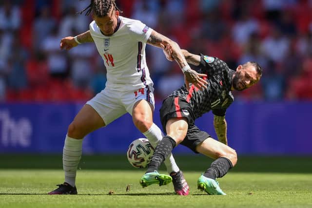 IN THE WAY: Leeds United's England international midfielder Kalvin Phillips, left, battles for possession with Croatia's Marcelo Brozovic during Sunday's Euro 2020 Group D opener at Wembley. Photo by Laurence Griffiths/Getty Images.
