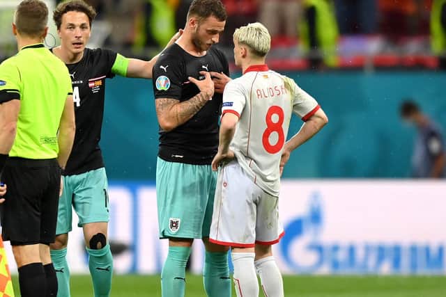 Marko Arnautovic and Gjanni Alioski exchange words following Austria's win over North Macedonia. Pic: Getty