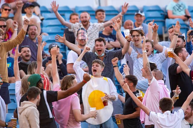 Fun in the sun: Fans on the Western Terrace at Headingley.
Picture Bruce Rollinson