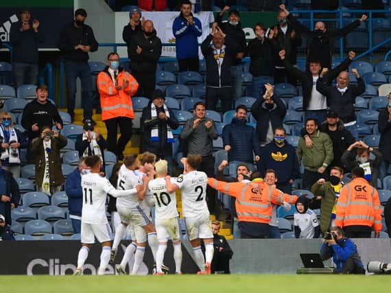 Leeds United celebrate with fans at Elland Road. Pic: Getty