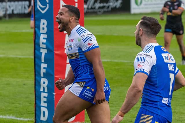 In at double: Kruise Leeming celebrates his second try for Leeds Rhinos in their last match at Castleford.