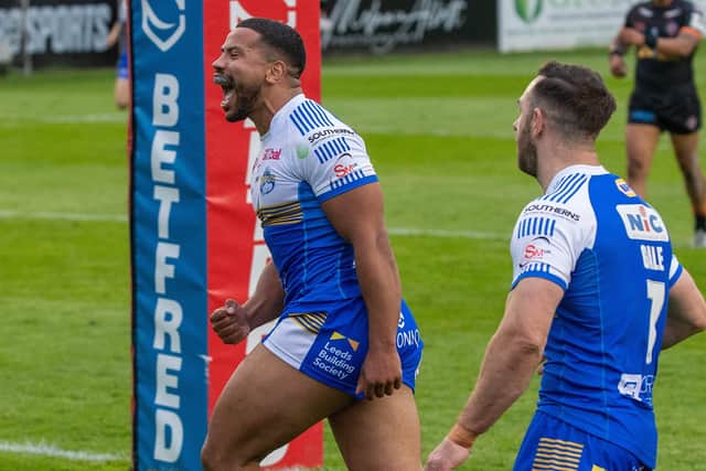 In at double: Kruise Leeming celebrates his second try for Leeds Rhinos in their last match at 
Castleford.