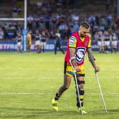 Gareth O'Brien on crutches, with his left knee in a brace, following Wednesday's game. Picture by Tony Johnson.