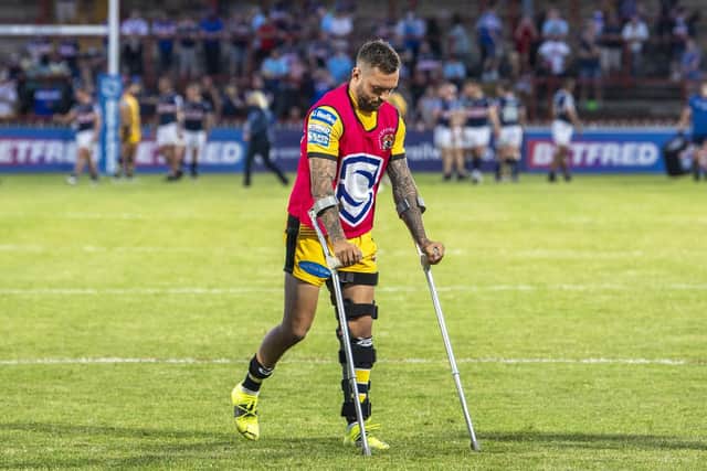 Gareth O'Brien on crutches, with his left knee in a brace, following Wednesday's game. Picture by Tony Johnson.