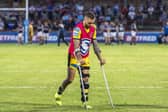 Gareth O'Brien on crutches, with his left knee in a brace, following Wednesday's game. Picture by Tony Johnson.