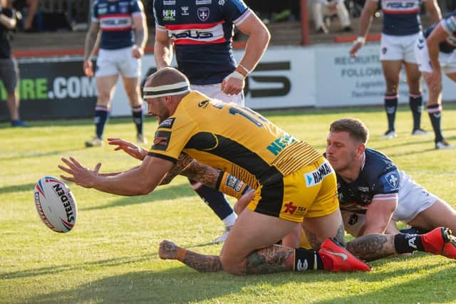 George Griffin scores Tigers' opening try in the win over Wakefield. Picture by Tony Johnson.