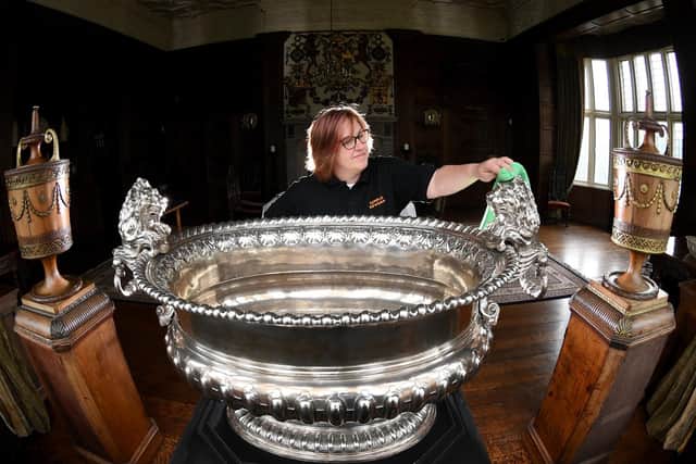 Visitor assistant Rebecca Allott cleans the 1750 silver wine cooler at Temple Newsam House, Leeds.
Picture by Simon Hulme