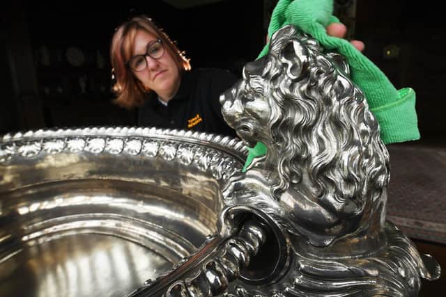 Visitor assistant Rebecca Allott cleans the 1750 silver wine cooler at Temple Newsam House, Leeds.
Picture by Simon Hulme