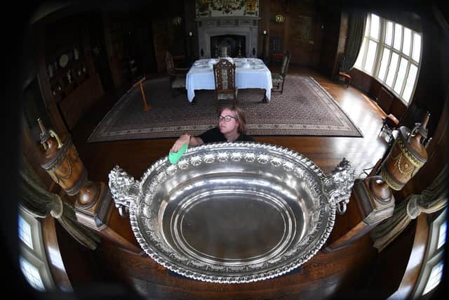 Visitor assistant Rebecca Allott cleans the 1750 silver wine cooler at Temple Newsam House, Leeds.
Picture by Simon Hulme