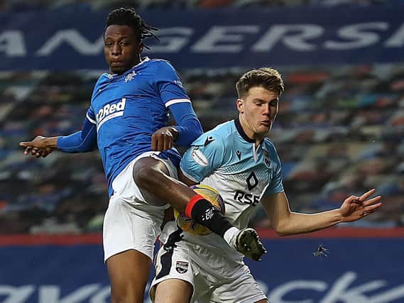 LEEDS RADAR - Joe Aribo of Rangers tangles with Leo Hjelde, who was on loan to Ross County from Celtic last season and is one of the youngsters Leeds United are monitoring ahead of their summer Under 23s recruitment. Pic: Getty