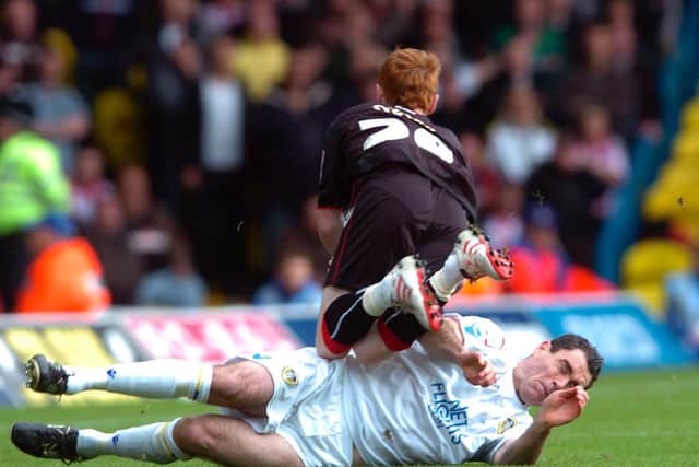 Andy Hughes puts on a robust challenge on Sheffield United's Stephen Quinn during a Chamspionship clash at Elland Road in September 2010.