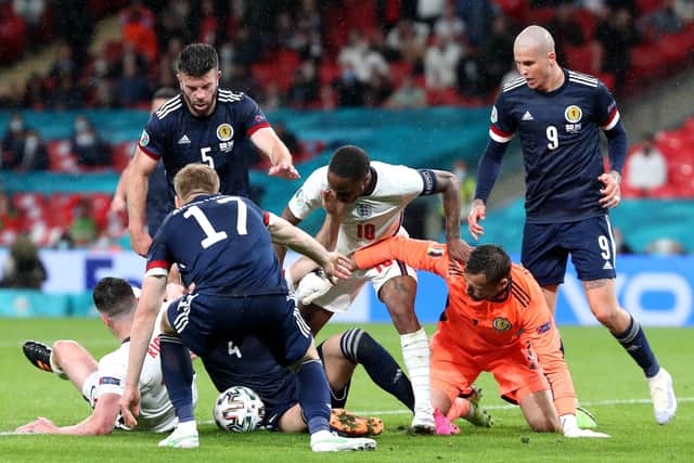England and Scotland players tussle for the ball in injury time (Picture: PA)