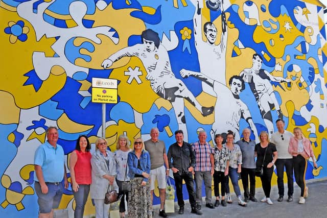 The family members of four Leeds United legends honoured in a new mural are joined by Eddie Gray for the unveiling. Picture: Steve Riding