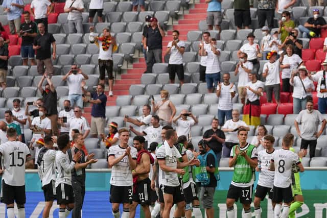 UP AND RUNNING: Leeds United defender Robin Koch, behind no 20 Robin Gosens, centre, applauds the fans after Germany's 4-2 victory against Portugal in Munich. Photo by MATTHIAS SCHRADER/POOL/AFP via Getty Images.
