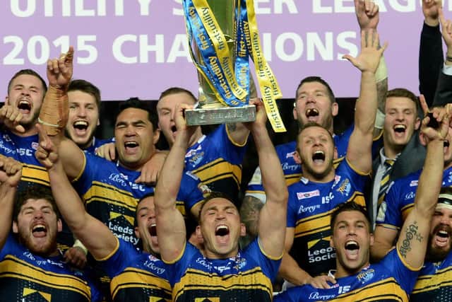 Leeds Rhinos captain Kevin Sinfield lifts the trophy after winning the First Utility Super League Grand Final at Old Trafford, Manchester, for the seventh and final time in 2015 (Picture: PA)