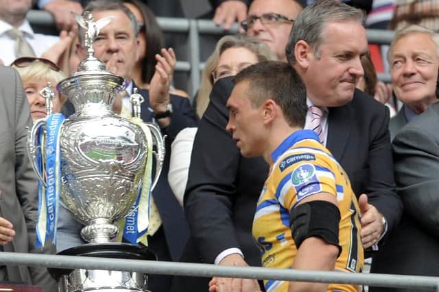 What might have been:
Kevin Sinfield glances at the Challenge Cup as he collects his losers medal in 2010. Five times he made that walk until finally getting his hands on the trophy in 2014. (Picture: Steve Riding)