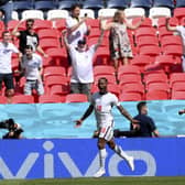 PLAY YOUR PART: England fans cheer as England's Raheem Sterling, left, celebrates with Mason Mount after scoring what proved to be the winning goal against Croatia at Euro 2020 at Wembley. Picture: Laurence Griffiths/AP.